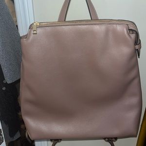 Taupe leather light weight back pack. Like new, perfect for work.